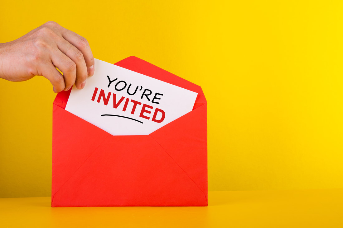 Licensed from https://unlimphotos.com/35930046/hand-holding-a-a-card-with-red-envelope-youre-invited-concepts.html